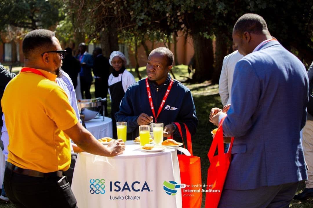 Delegates networking over refreshments during a break at GRC 2026