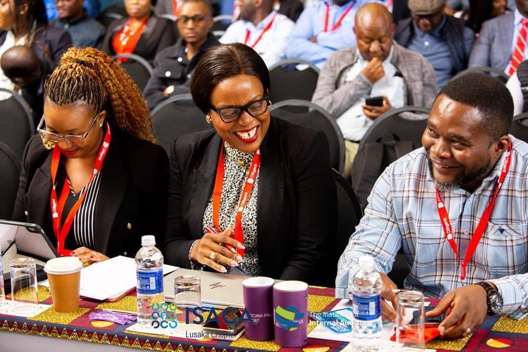 Delegates sharing a light moment between sessions at GRC 2026